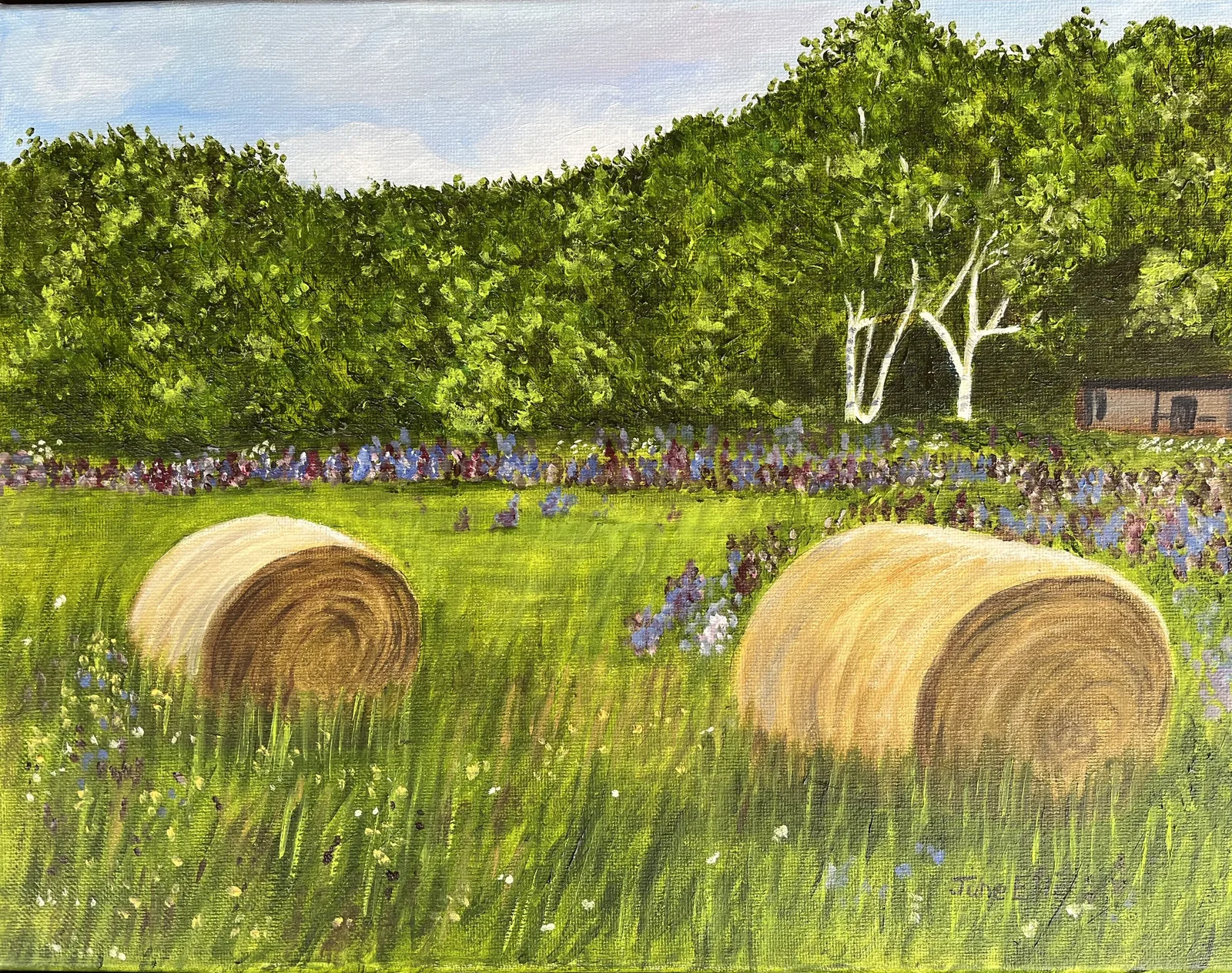 Original PEI oil painting of hay bales in a Prince Edward Island field surrounded by summer blossoms by June Ellis PEI Art