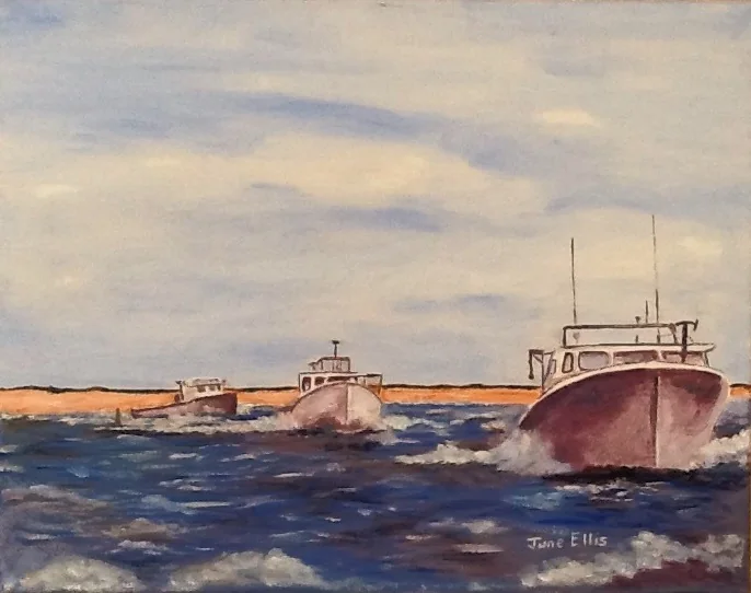 Fishing boats heading out to sea in choppy waters