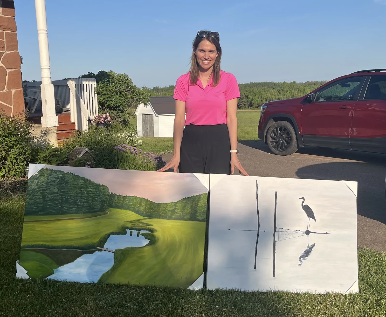 Amy with two large finished commission paintings